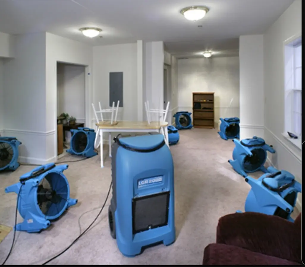 Air movers and dehumidifier setup for Water Damage Restoration in Mahomet